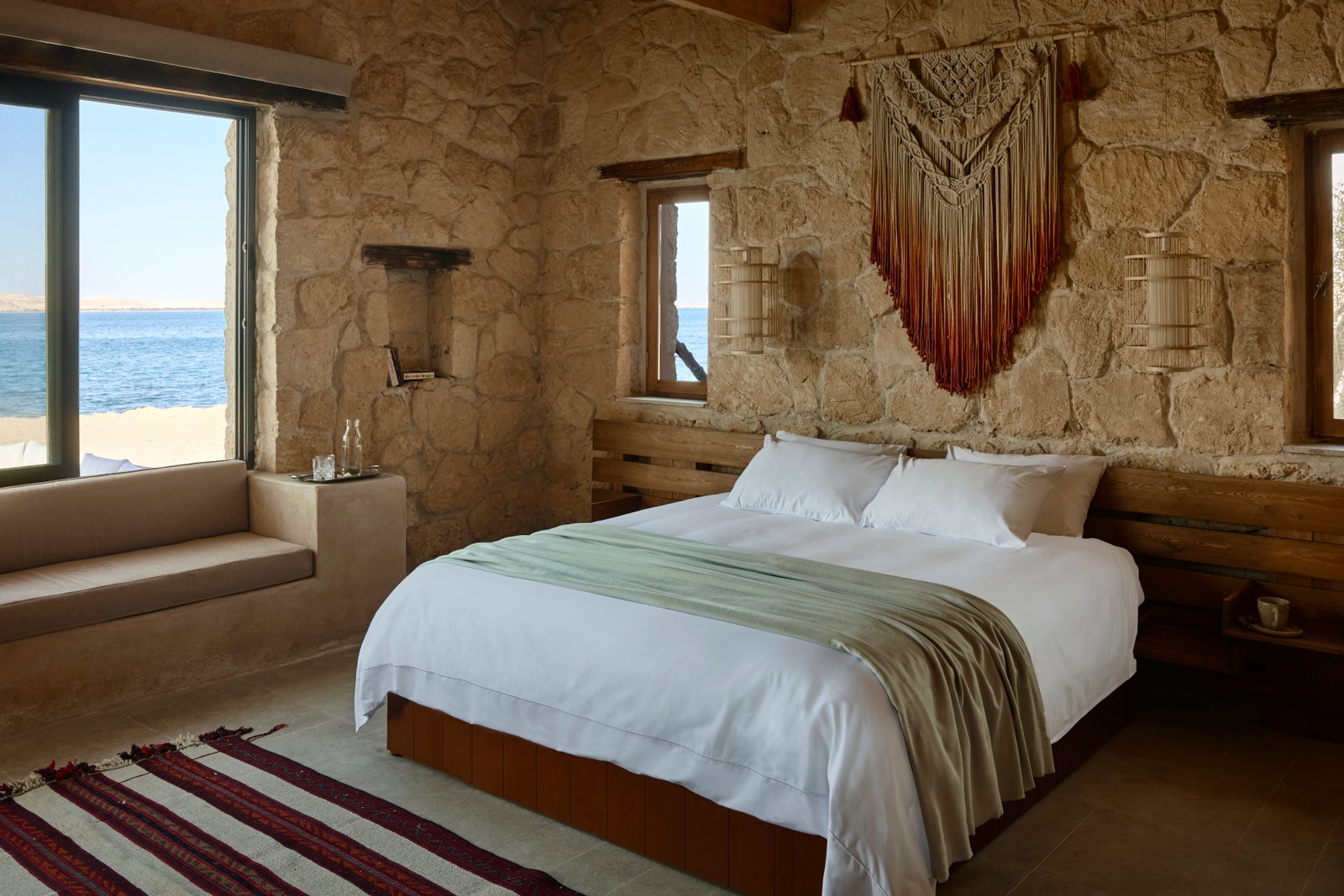 Lake-facing bedroom with twin beds under Siwan medallions